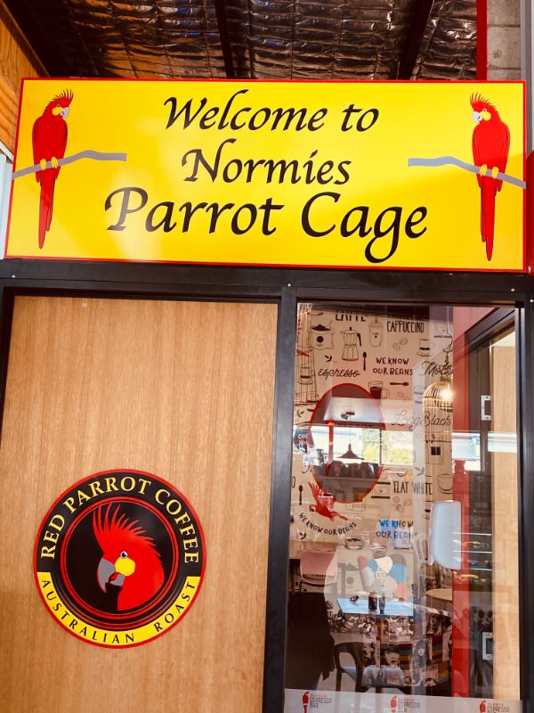 Norm the Red Parrot Coffee mascot welcomes you!